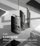 iPhone 16 Pro Screen Protector | Easy Slide Privacy Tempered Glass - iPhone 16 Pro Screen Protector - Privacy glass being applied to an iPhone 16 Pro, showing a darkened screen from the side.