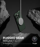 iPhone 16 Pro Case | Rugged Gear Magnetic - Green rugged phone case floating between dark rocks with a magnetic charger.