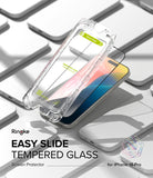 iPhone 16 Pro Screen Protector | Easy Slide Tempered Glass - iPhone 16 Pro Screen Protector - Clear Easy Slide installation frame hovering over an iPhone 16 Pro on a white surface.