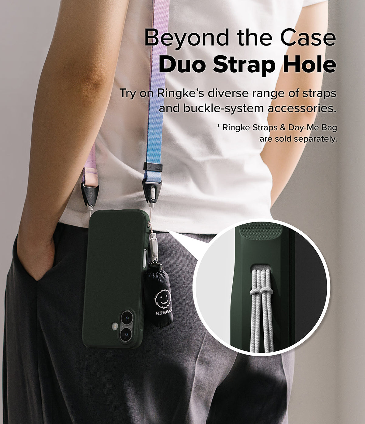 iPhone 16 Case | Onyx - Person wearing a dark green phone case with a colorful strap and small accessory bag attached.