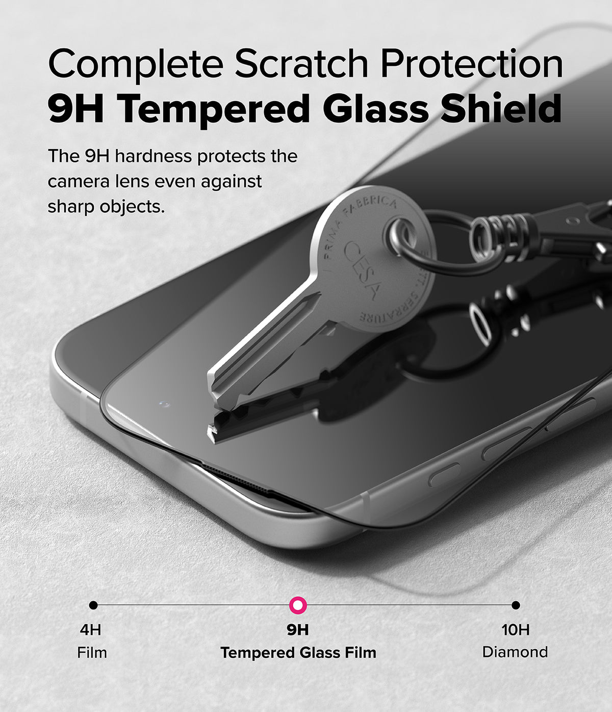 iPhone 16 / 15 Screen Protector | Easy Slide Tempered Glass - A metal key scratching a 9H tempered glass screen protector.