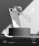 iPhone Air Case | Air - A clear phone case floating above a silver iPhone on a stone pedestal with white feathers.