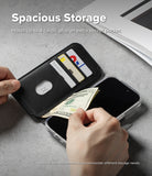 iPhone 17 Pro Max Cover | Folio Grip Wallet Magnetic - Black folio wallet case holding three cards and a twenty-dollar bill, with hands adjusting the storage.