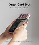 iPhone 17 Pro Max Cover | Folio Grip Wallet Magnetic - Hands holding a phone case with an outer card slot containing a credit card and a grip strap.