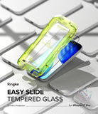 [Bundle] iPhone 17 Pro | Fusion Magnetic - iPhone 17 Pro | Fusion Magnetic - A lime green Easy Slide tempered glass installation tool hovering over an iPhone 17 Pro.