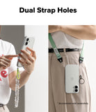 iPhone 17 Case | Air - Clear phone case with dual strap holes, shown held in hand and worn crossbody with a green lanyard.
