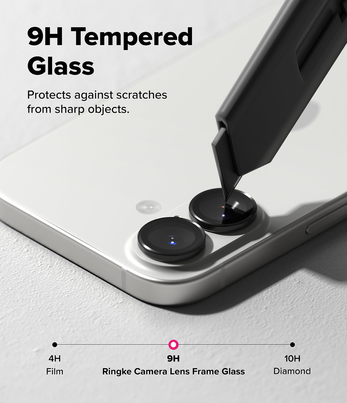 [Bundle] iPhone 17 | Onyx Magnetic - A utility knife blade touches a 9H tempered glass camera lens protector on an iPhone.