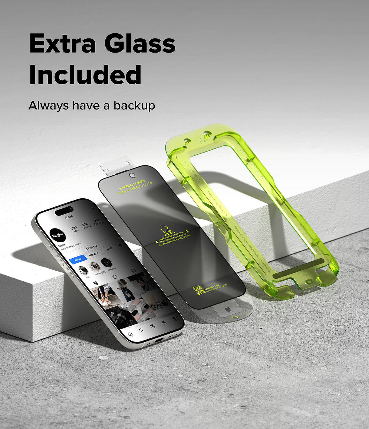 iPhone 17 Screen Protector | Easy Slide Privacy Tempered Glass - iPhone 17 Screen Protector - Smartphone, privacy screen protector, and green plastic installation frame on a gray surface.