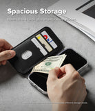 iPhone 16 Cover | Folio Grip Wallet Magnetic - Black folio case holding cards and cash with hands inserting a bill.