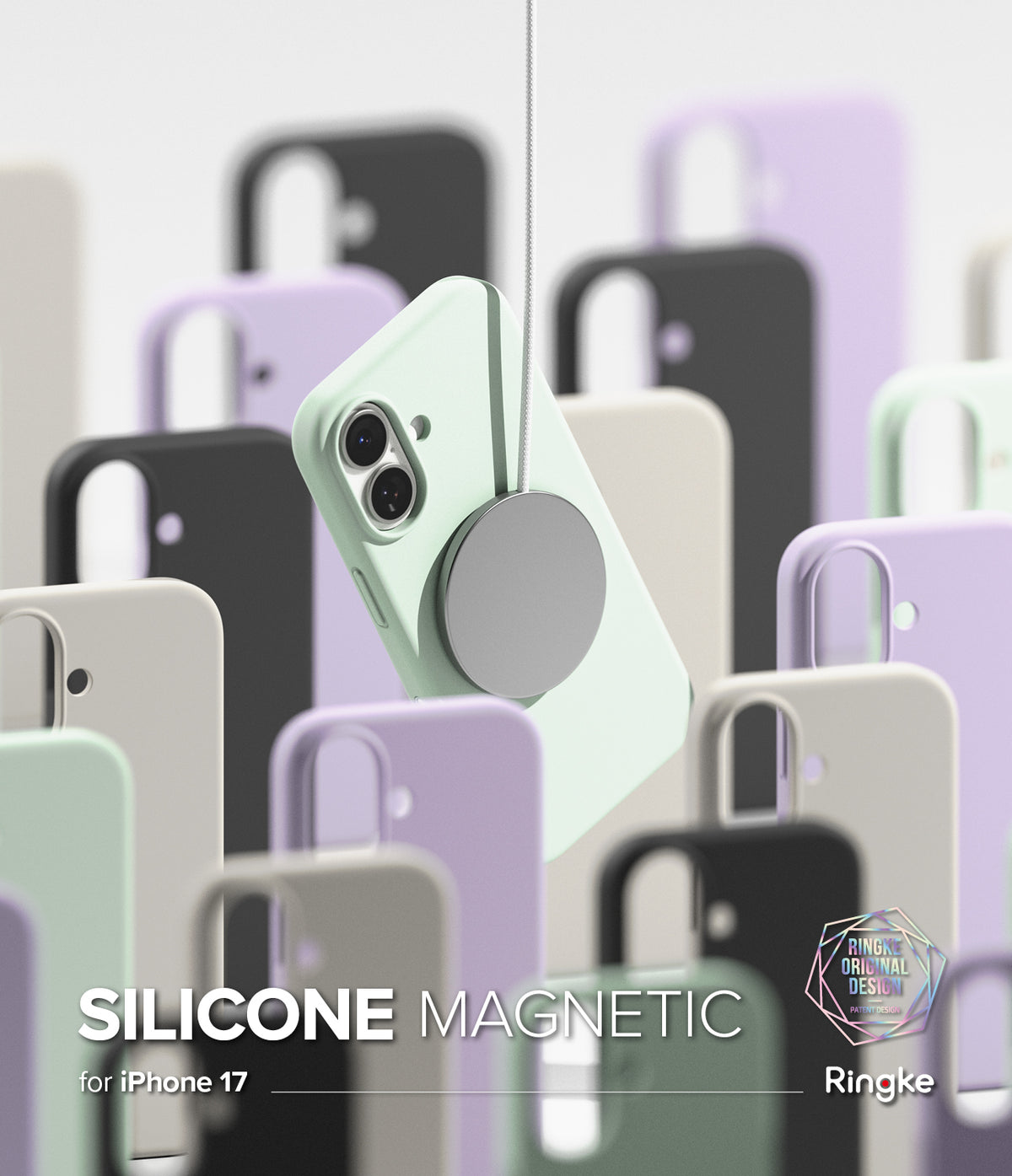 [Bundle] iPhone 17 | Silicone Magnetic - Mint iPhone 17 case suspended by a magnetic charger amidst blurred colorful silicone cases.