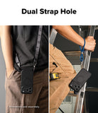 iPhone 18 Pro Max Case | Alles - A split-panel product demonstration showing a black phone case with a circular MagSafe ring and a dual strap system. The left panel shows the case hanging from a black shoulder strap worn by a person in a black shirt and brown pants.