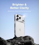iPhone 18 Pro Max Case | Fusion - A clear protective phone case shown on the back of a white iPhone, standing on dark rocks against a blue sky background. White text at the top reads 'Brighter & Better Clarity' with smaller descriptive copy below.