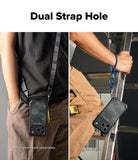 iPhone 18 Pro Max Case | Rugged Gear Magnetic - A phone case with a dark camouflage pattern is shown being worn and held by a person, demonstrating a dual strap design. The left panel shows the case hanging from a shoulder strap, and the right panel shows a hand holding a ladder while wearing a blue lanyard attached to the case.