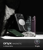 iPhone 18 Pro | Onyx Magnetic - Three Ringke Onyx Magnetic phone cases for iPhone 18 Pro are displayed in a dramatic studio setting with dark rocks. One black case is shown with a white MagSafe ring attached, a green case lies in the foreground, and two additional cases (one camouflage, one dark purple) stand behind.