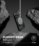 iPhone 18 Pro Case | Rugged Gear Magnetic - A black rugged phone case with a circular magnetic ring is shown floating between dark rock formations. Text at the bottom reads 'RUGGED GEAR MAGNETIC for iPhone 18 Pro' with the Ringke logo, and a white vertical line extends from the magnetic ring.