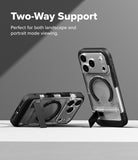 iPhone 18 Pro Case | UX Magnetic - Transparent phone case with black bumper edges and a built-in kickstand, shown standing upright and propped horizontally on a light surface against a gray background. White text at the top reads 'Two-Way Support' with smaller supporting copy.