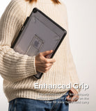 Fusion Sketch Stand | iPad - Person in a cream sweater holding a clear iPad case with a built-in kickstand and black textured edges.