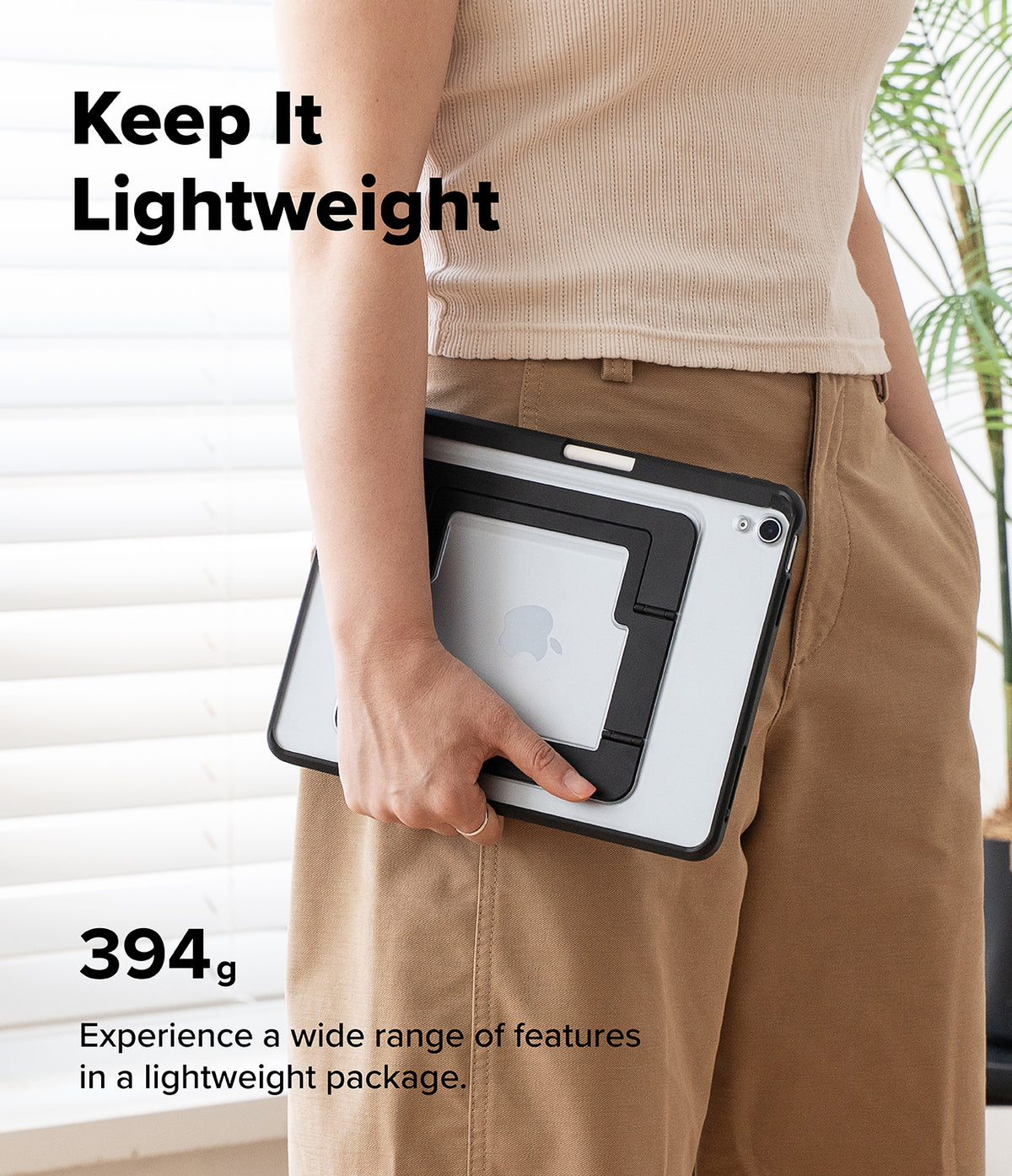 Ringke Apple iPad Pro (11") / Air (11", 10.9") Case [Multiverse Case] - A person in a beige ribbed top and tan pants holds a slim black-and-white tablet case with a built-in stand. Large text reads 'Keep It Lightweight' and '394g Experience a wide range of features in a lightweight package.