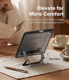 Ringke Apple iPad Pro (11") / Air (11", 10.9") Case [Multiverse Case] - A dark gray tablet stand shown in a home office setting, holding a tablet upright on a desk. The scene includes a person reading in the background, coffee cups, and text overlays explaining the stand's height feature ('Elevate for More Comfort', 'Max 4.