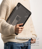 Fusion Sketch Stand | iPad - Person in a cream sweater holding a dark, transparent iPad case with an integrated kickstand.