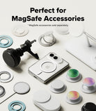 iPhone Duo | Fusion Magnetic - A promotional flat lay showing MagSafe-compatible accessories around a white smartphone on a light background, with text reading 'Perfect for MagSafe Accessories.' Visible items include a black magnetic mount, white rings/cups, a white stand, and several circular magnetic pieces in white, black, teal, green, and iridescent colors.