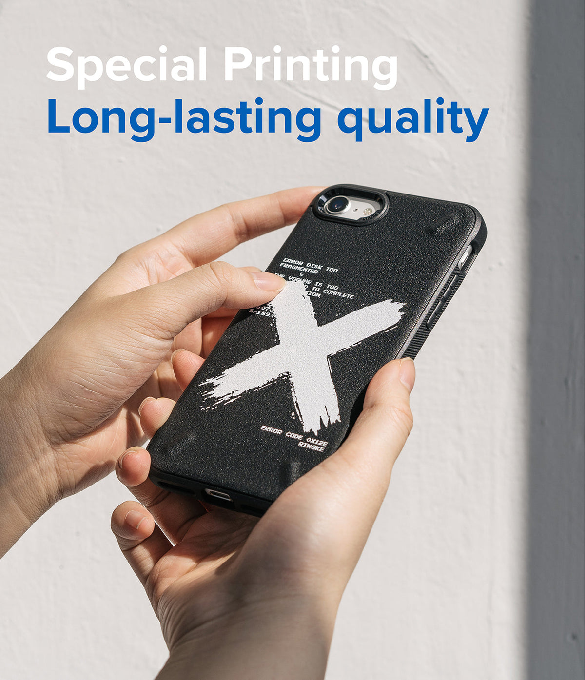 iPhone SE 2022 5G / SE 2020 / 8 / 7 Case | Onyx Design - Hands holding a black phone case with a white brushstroke X design.