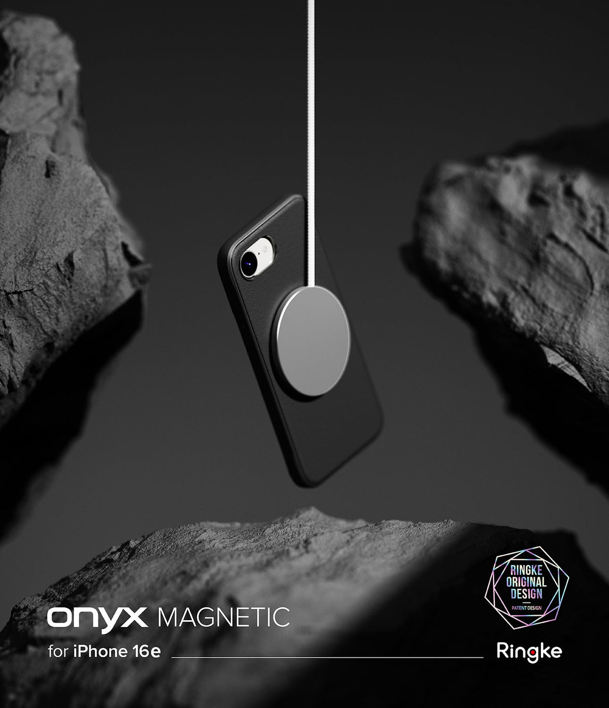 iPhone 16e Case | Onyx Magnetic - Black phone case suspended by a magnetic charger between dark, textured rocks.