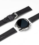 Watch Lug 20mm | Rubber One Band - A silver smartwatch case with a black ribbed rubber strap detached on a white background.