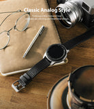 Watch Lug 20mm | Leather One Classic Band - Smartwatch with black leather strap on a wooden desk with a camera and glasses.