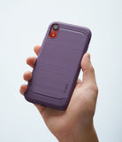 iPhone XR Case | Onyx - A hand holding a lilac purple phone case with a brushed texture and ribbed top and bottom accents.