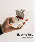 Card Holder | Magnetic Stand Slot - Hand holding a phone with a magnetic card holder stand open, revealing credit cards.