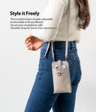 Mini Cross Bag | PU Leather - Woman wearing a beige PU leather smartphone crossbody bag with an adjustable strap.
