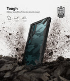 Mi Note 10 / 10 Pro Case | Fusion-X - Camouflage phone case with black frame standing in dirt, highlighting military-grade drop protection.