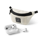 Mini Pouch | Sling Bag - Cream-colored mini pouch with black zipper and label next to white wireless earbuds and charging case.