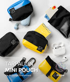 Mini Pouch Tarpaulin | Roll Top - Colorful tarpaulin mini pouches with black mesh pockets, holding small items like notebooks and earbuds.