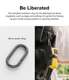 Mini Pouch Tarpaulin | Roll Top - A metal carabiner ring and a yellow roll-top pouch clipped to a black backpack.