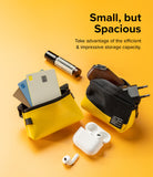 Mini Pouch Tarpaulin | Roll Top - Two yellow and black pouches on a yellow background holding cards, a charger, and earbuds.