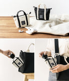 Mini Pouch | Tote Bag - Beige and black mini pouches with tote bags, shown holding wireless earbuds on a wooden surface.