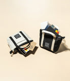 Mini Pouch | Tote Bag - Two miniature tote pouches in black and white, filled with cards, a lipstick, and small items.