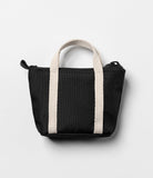Mini Pouch | Tote Bag - Small black textured pouch with beige canvas handles and a top zipper on a white background.