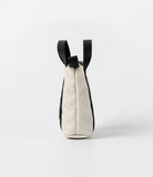 Mini Pouch | Tote Bag - Side view of a small cream canvas pouch with black webbing handles against a white background.