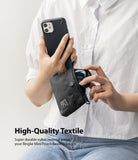 Mini Pouch | 2-Way Bag Miniature - Mini Pouch - Person holding a black nylon pouch containing wireless earbuds while holding a smartphone in a black case.
