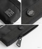 Mini Pouch | 2-Way Bag Miniature - Close-up of black fabric pouch showing branded label, circular Ringke logo button, and zipper pull.