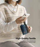 Mini Pouch | 2-Way Bag Miniature - Person holding a navy blue nylon mini pouch with a black strap and small brand label.