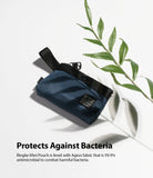 Mini Pouch | 2-Way Bag Miniature - Navy blue mini pouch with black strap and Ringke label next to a green leaf on white.
