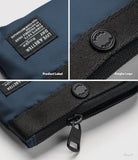 Mini Pouch | 2-Way Bag Miniature - Close-up of navy pouch details including a branded fabric label, logo button, and zipper.