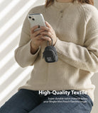 Mini Pouch | Block - Person holding a smartphone with a small black nylon pouch clipped to their hand.