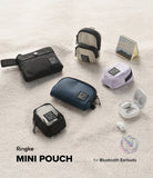 Mini Pouch | Block - Assorted small fabric pouches in black, blue, beige, and lavender arranged on a white textured surface.