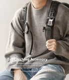 Mini Pouch | Block - A small black pouch with a clear window attached to a backpack strap via a carabiner.