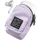 Mini Pouch | Block - Lavender mini pouch with a black label holding white wireless earbuds against a white background.